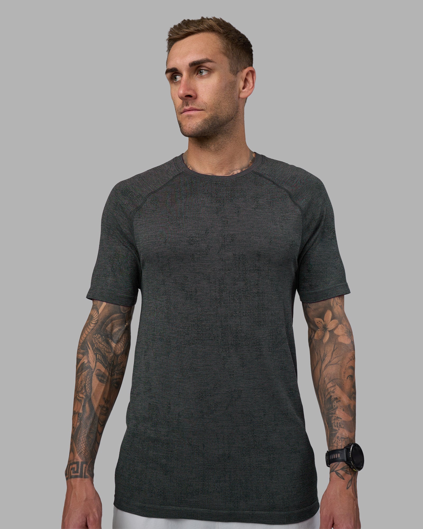 Man wearing AeroFLX+ Seamless Tee - Black Camo-Graphite | Model:Tommy | Size:L
