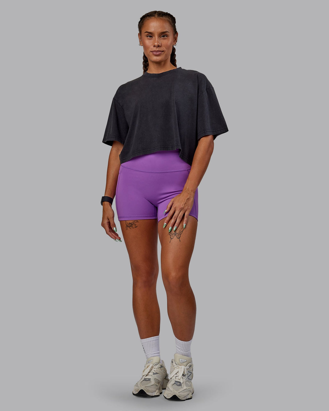 Woman wearing Miami 2025 FLXCotton Cropped Tee - Black-Purple Swirl