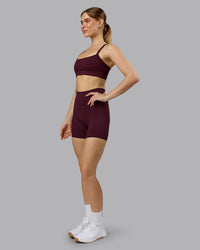 Woman wearing Momentum Sports Bra - Cherry Lacquer | Model:Emilie | Size:S | Thumbnail Index: 2