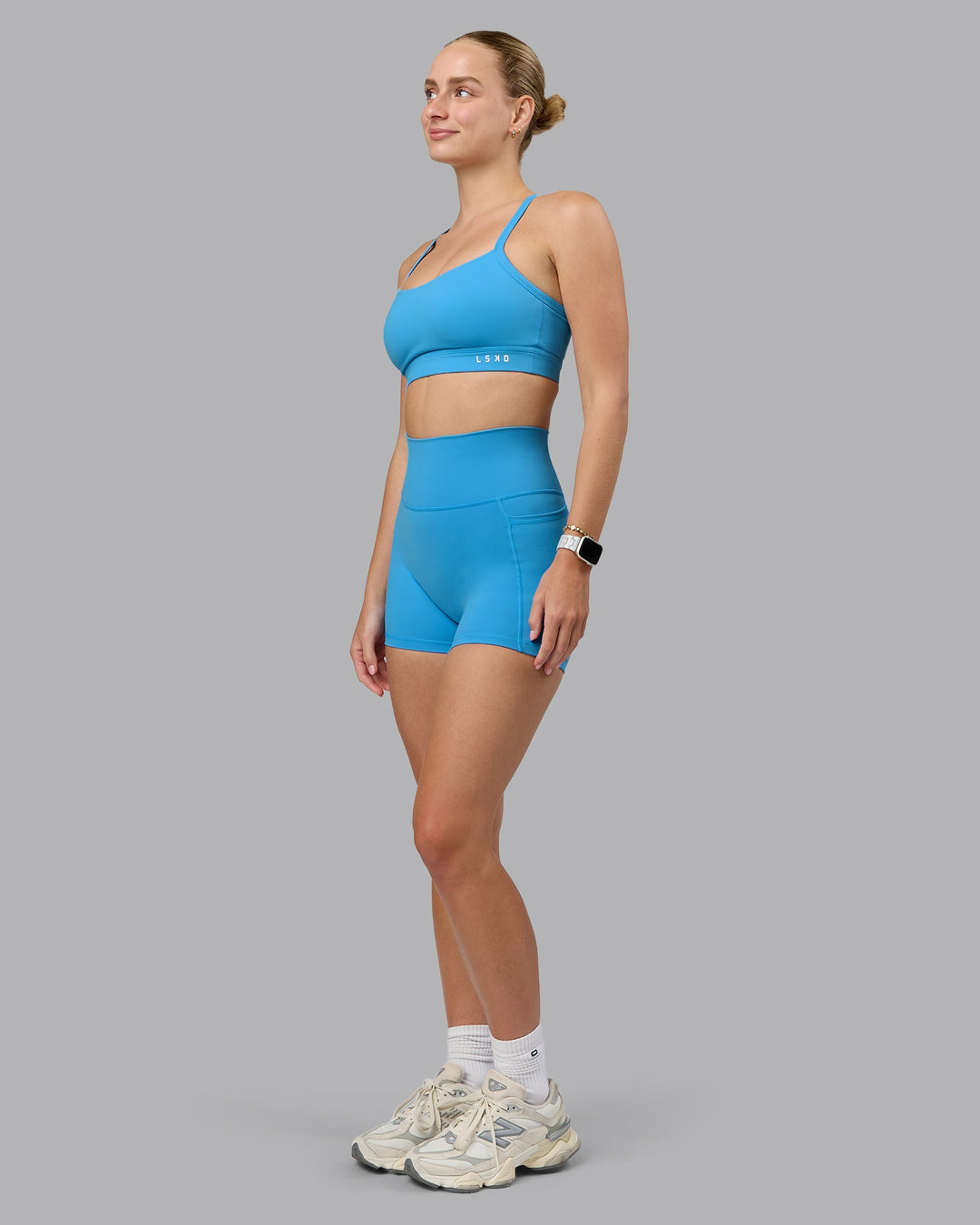 Woman wearing Momentum Sports Bra (D/DD/E) in Azure Blue | Size:S