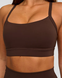 Woman wearing Momentum Sports Bra D/DD/E - Hot Chocolate | Model:Bianca | Size:S