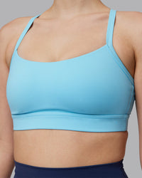 Woman wearing Momentum Sports Bra D/DD/E - Sky Blue | Model:Lillie | Size:S