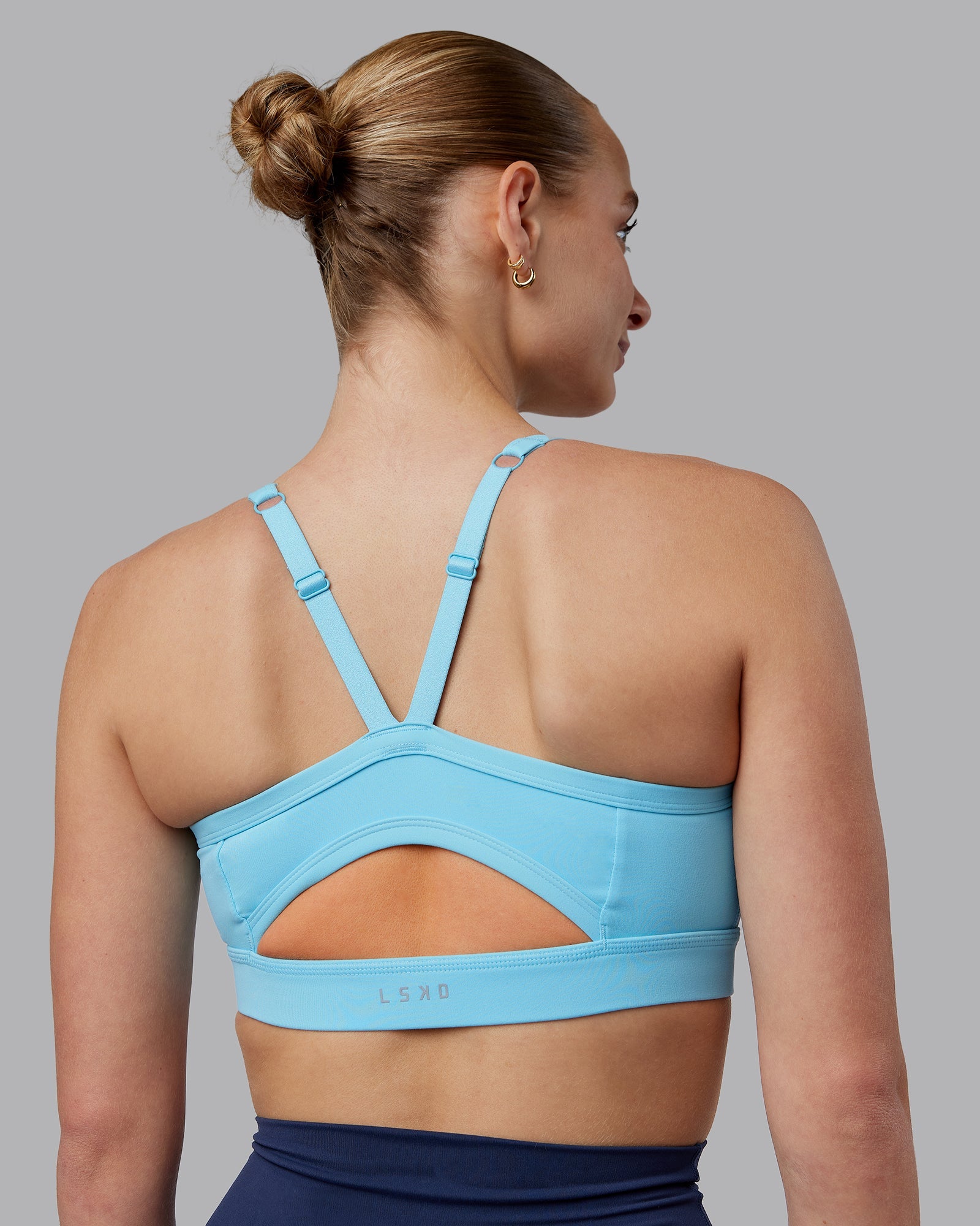 Woman wearing Momentum Sports Bra D/DD/E - Sky Blue | Model:Lillie | Size:S