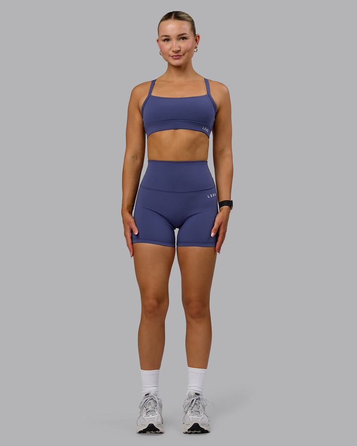 Woman wearing Momentum Sports Bra - Future Dusk
