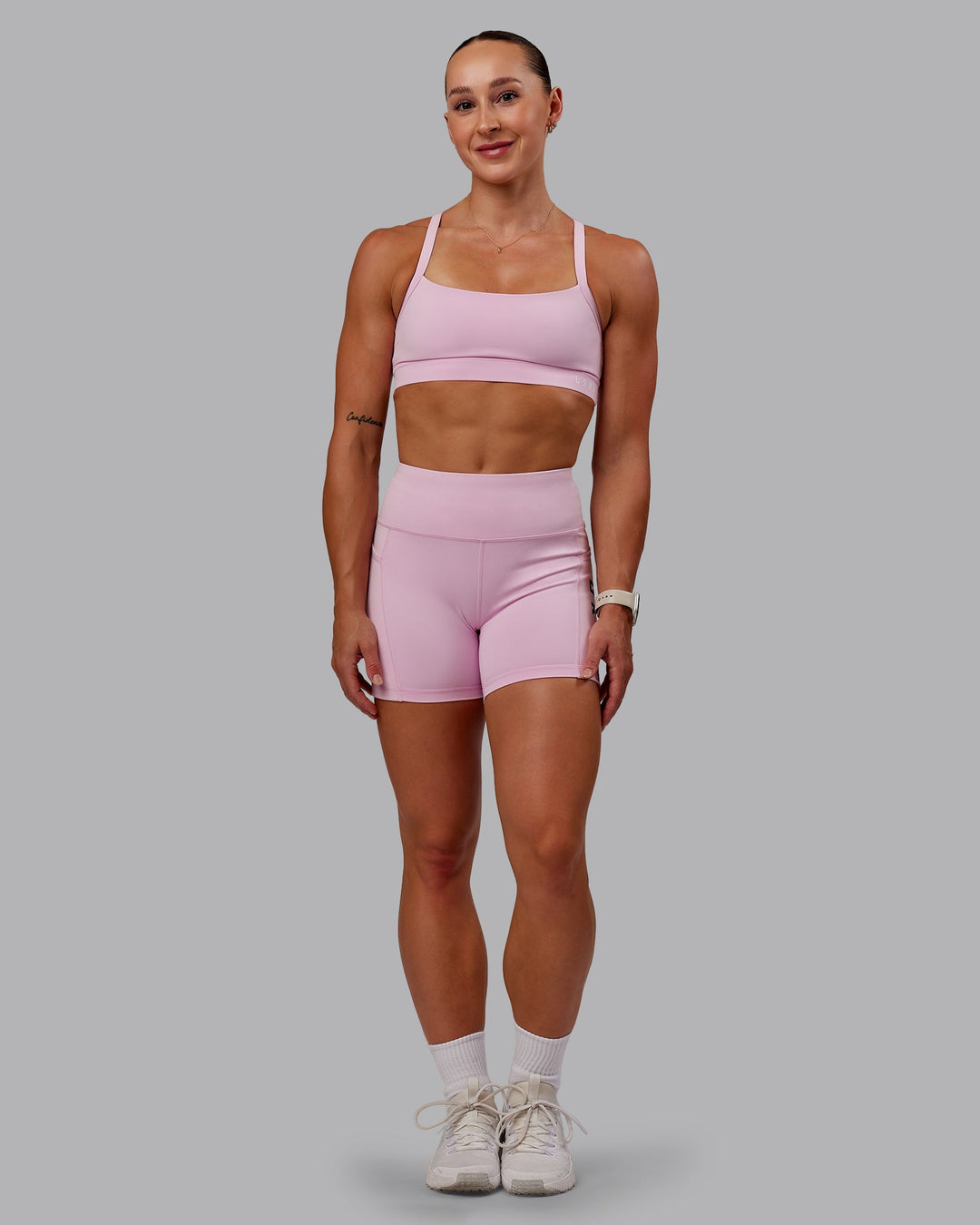 Woman wearing Momentum Sports Bra - Marshmallow