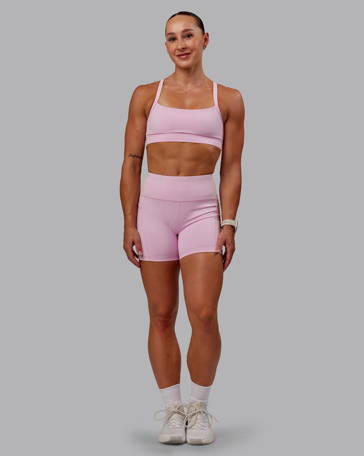 Woman wearing Momentum Sports Bra - Marshmallow
