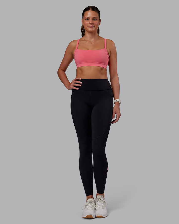 Woman wearing Momentum Sports Bra - Pink Lemonade | Model:Phoebe | Size:S
