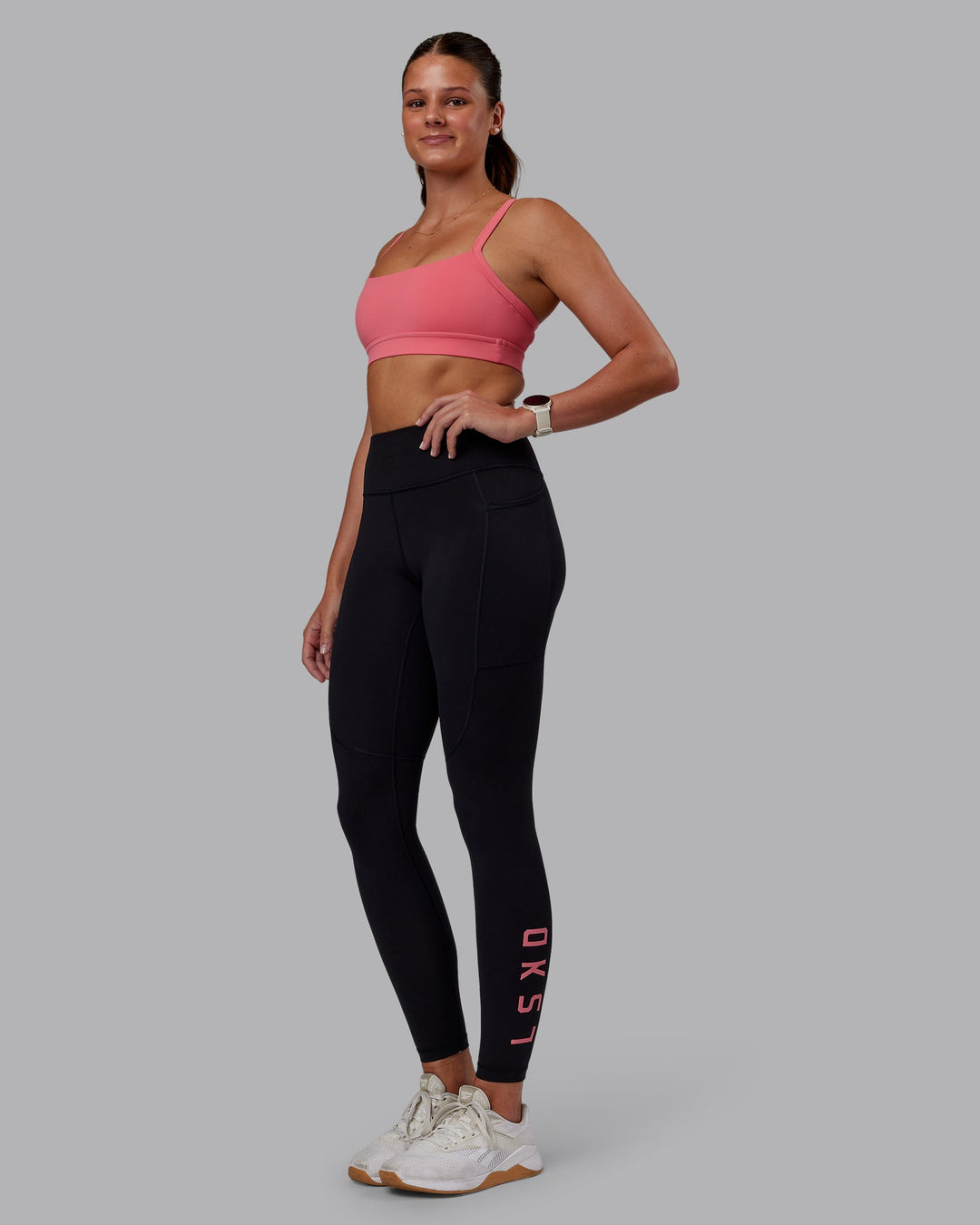 Woman wearing Momentum Sports Bra - Pink Lemonade | Model:Phoebe | Size:S