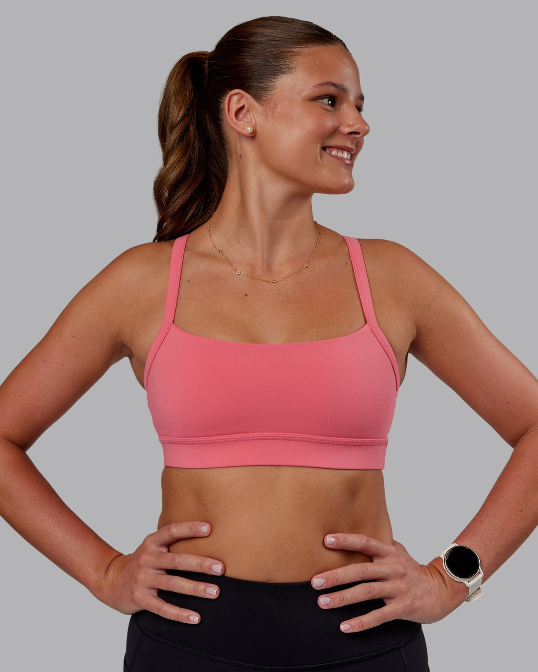 Woman wearing Momentum Sports Bra - Pink Lemonade | Model:Phoebe | Size:S