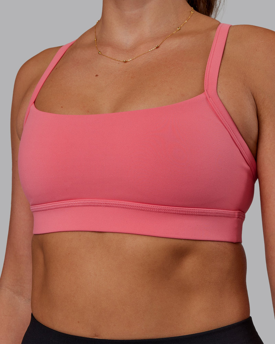 Woman wearing Momentum Sports Bra - Pink Lemonade | Model:Phoebe | Size:S