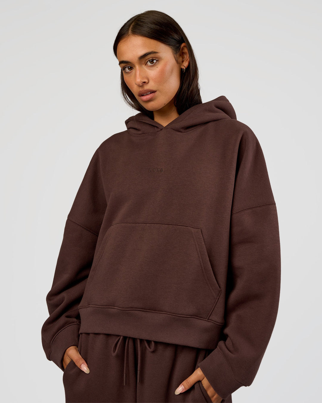 Woman wearing Post Train Hoodie - Hot Chocolate | Model:Ruby | Size:S - view 1