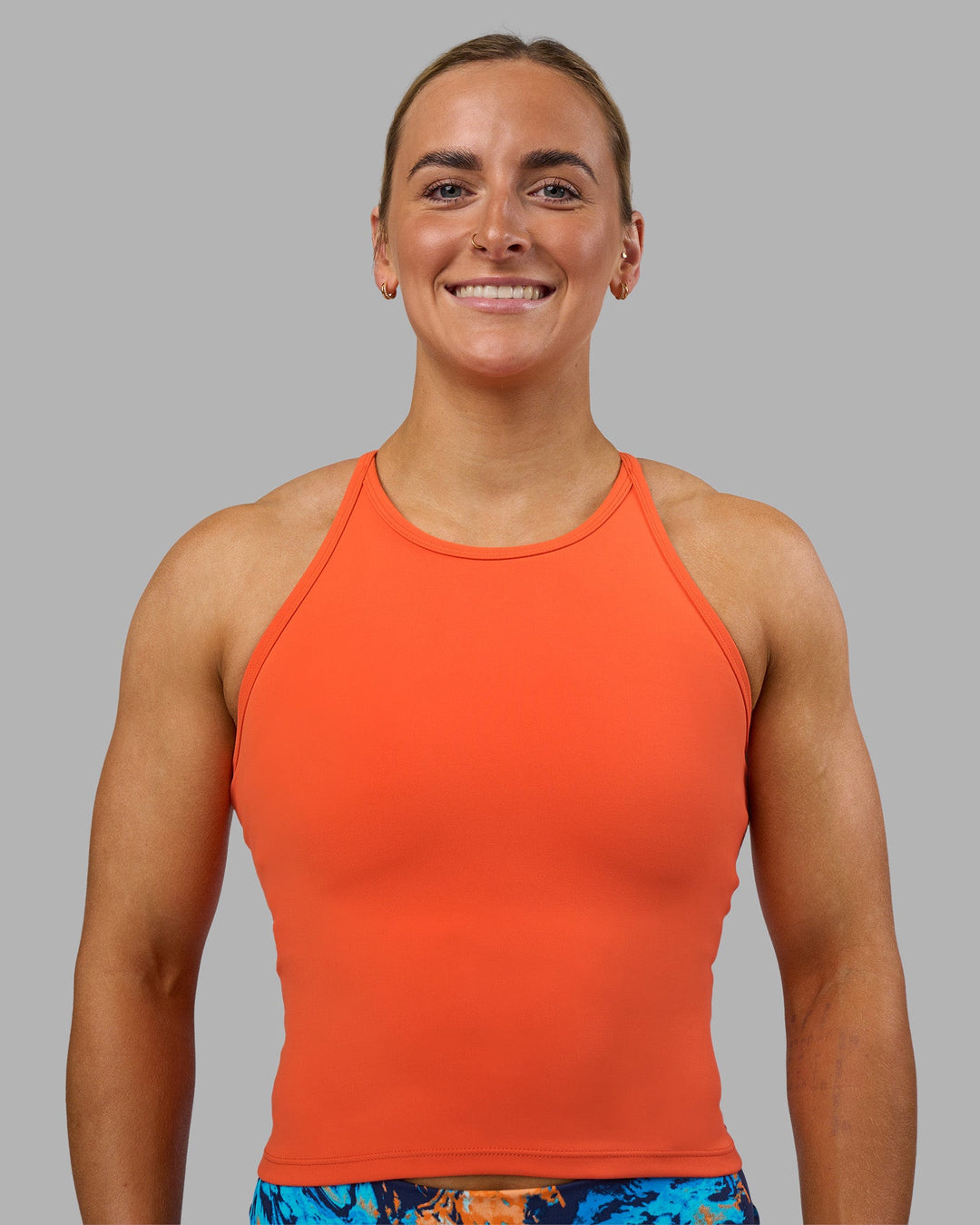 Woman wearing Power Performance Tank - Ultra Orange | Model:Georgia | Size:S