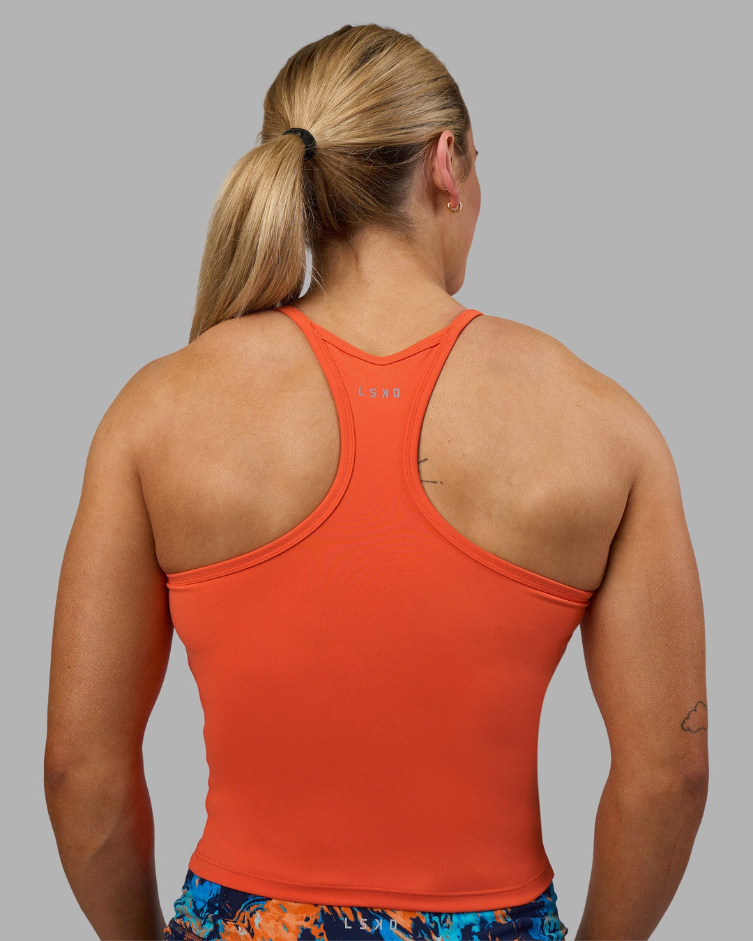 Woman wearing Power Performance Tank - Ultra Orange | Model:Georgia | Size:S