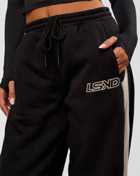 Woman wearing Power Play Stitch Up Fleece Sweat Pant - Black-Shale Beige | Model:Bianca | Size:S