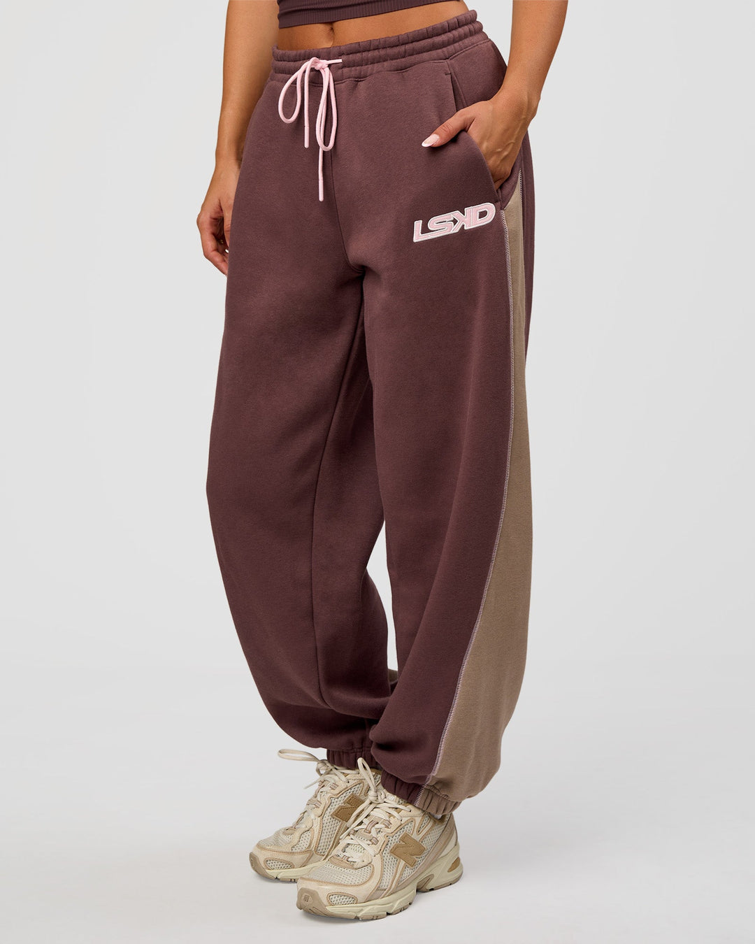 Woman wearing Power Play Stitch Up Fleece Sweat Pant - Cocoa Powder-Marshmallow | Model:Bianca | Size:S