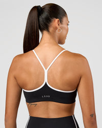 Woman wearing Power Sweetheart Sports Bra - Black | Model:Rhiley | Size:S