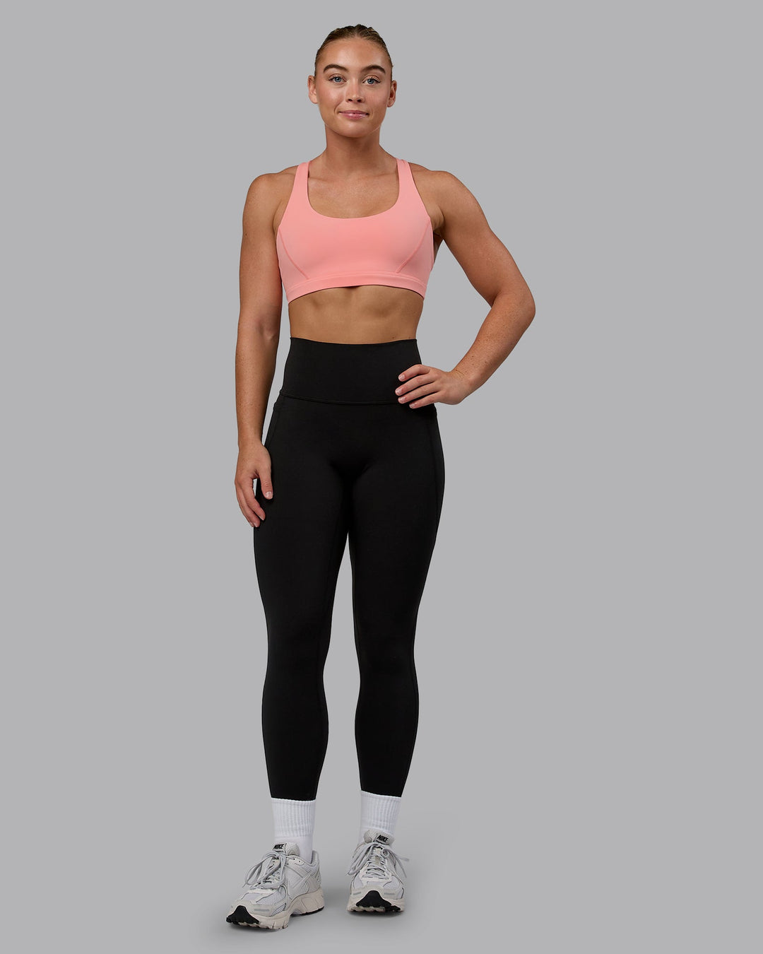 Woman wearing Precision Sports Bra - Murex Shell