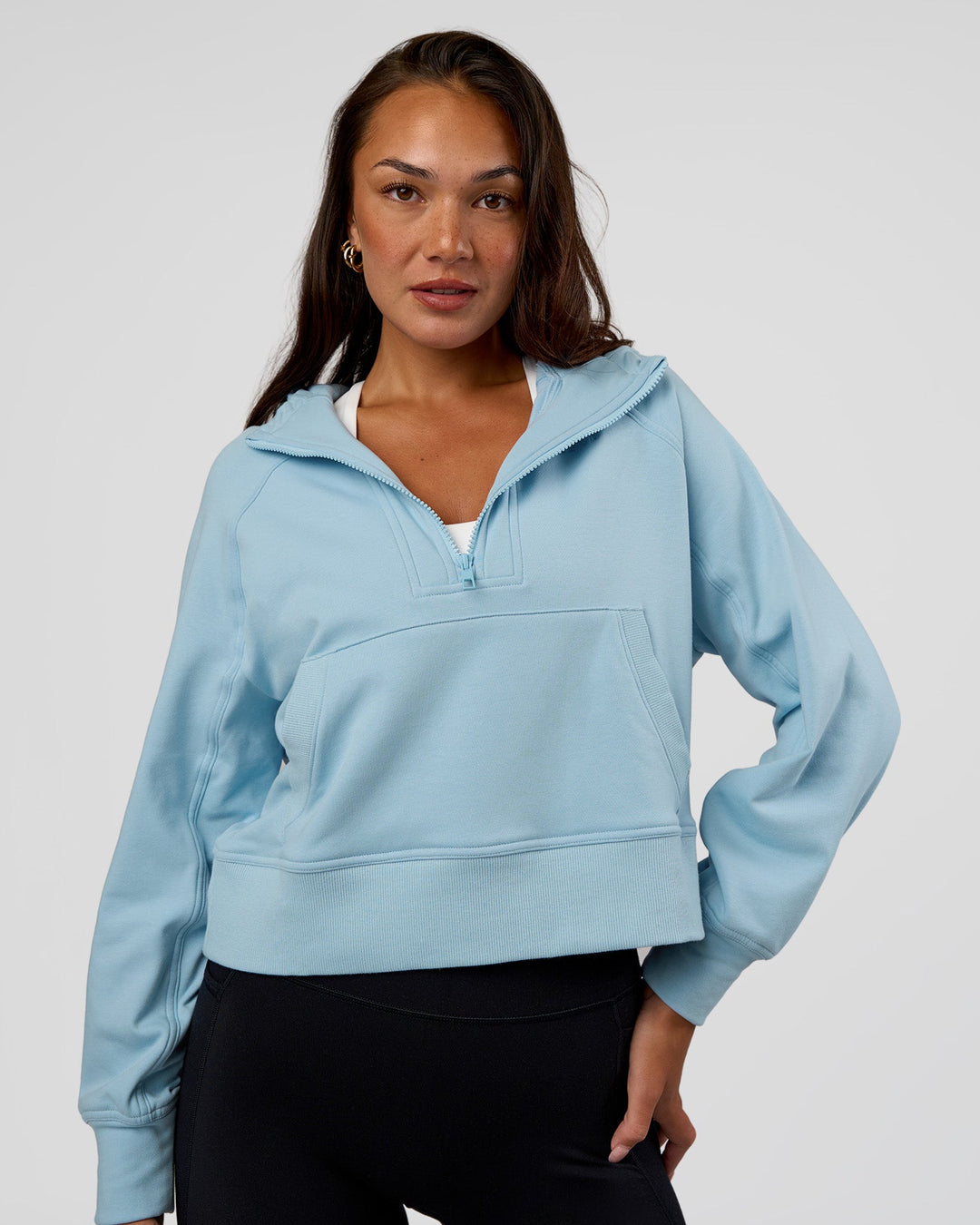 Woman wearing Pursue Mid-Weight Hoodie - Glacial Blue | Model:Kirstyn | Size:S