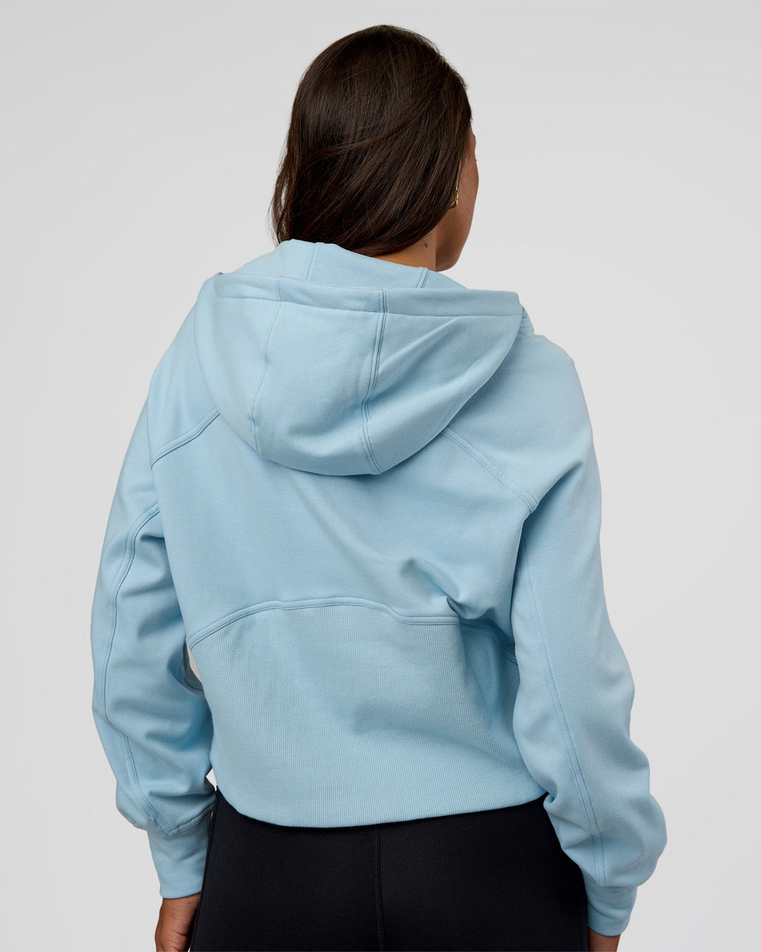 Woman wearing Pursue Mid-Weight Hoodie - Glacial Blue | Model:Kirstyn | Size:S