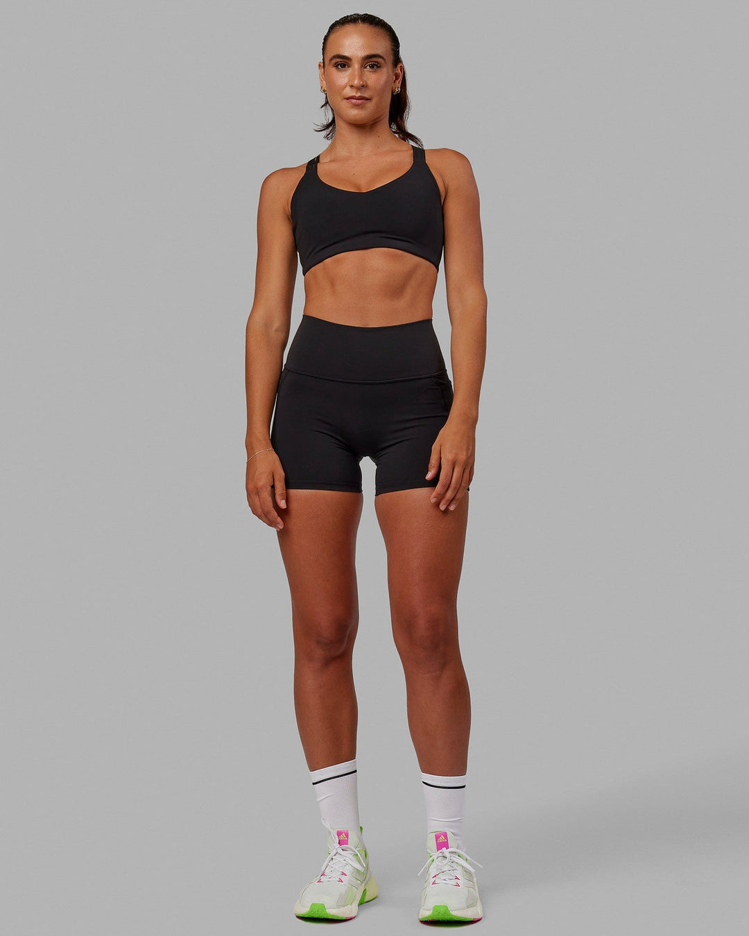 Woman wearing Push The Limit Sports Bra - Black