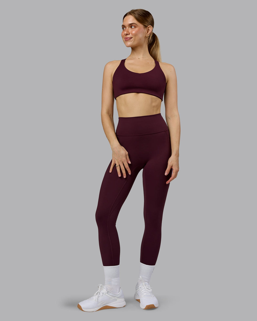 Woman wearing Push The Limit Sports Bra - Cherry Lacquer  Model:Emilie | Size:S