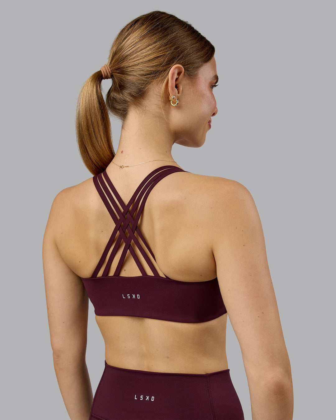 Woman wearing Push The Limit Sports Bra - Cherry Lacquer  Model:Emilie | Size:S