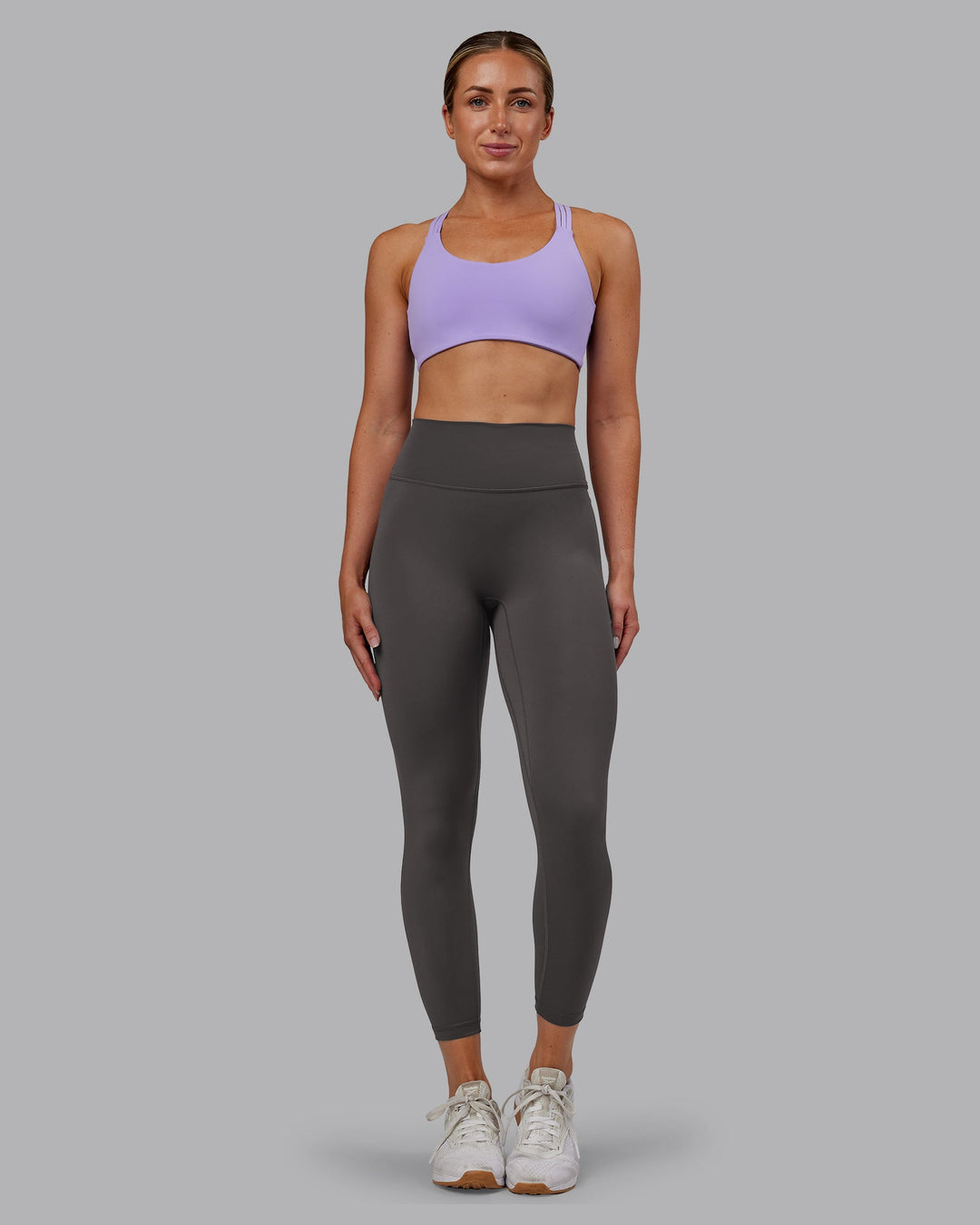 Woman wearing Push The Limit Sports Bra - Violet Ray | Model:Paris | Size:S