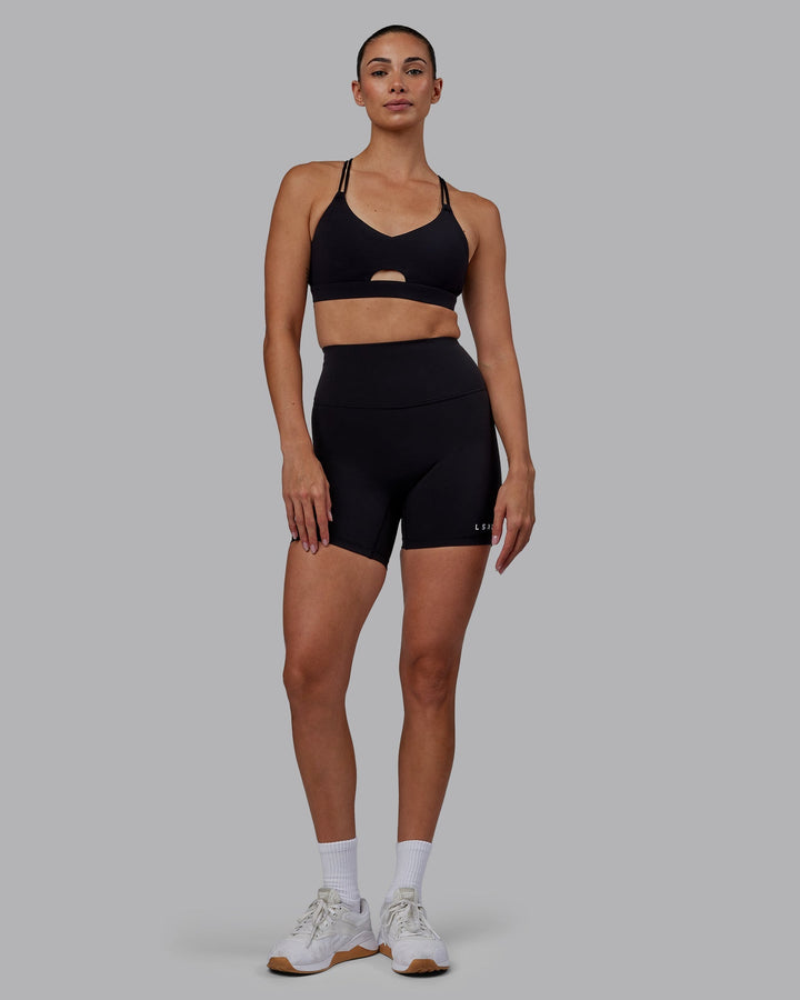 Woman wearing RXD High Waist Mid-Length Shorts - Black
