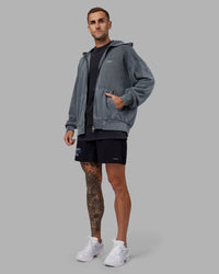 Man wearing Relentless Washed Zip Through Oversized Hoodie - Dark Storm-White | Model:Tommy | Size:S