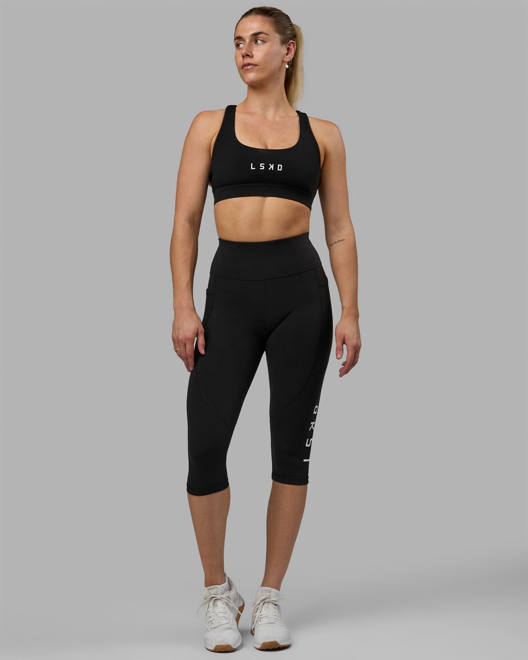 Woman wearing Rep 3/4 Length Leggings - Black-White