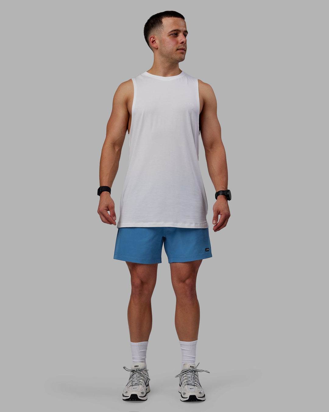 Man wearing Rep 5&quot; Lined Performance Shorts - Elemental Blue