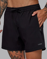 Man wearing Rep 5" Lined Performance Shorts in Black | Size:S | Thumbnail Index: 0