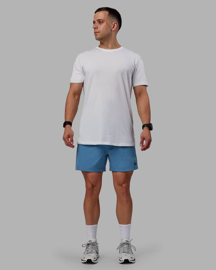 Man wearing Rep 5&quot; Performance Shorts - Elemental Blue
