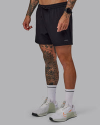 Man wearing Rep 5'' Performance Short in Black | Size:S