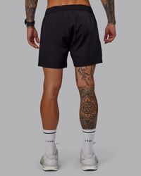 Man wearing Rep 5'' Performance Short in Black | Size:S