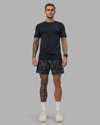 Man wearing Rep 5" Performance Short - Lunar Glow Print | Model:Tommy | Size:S