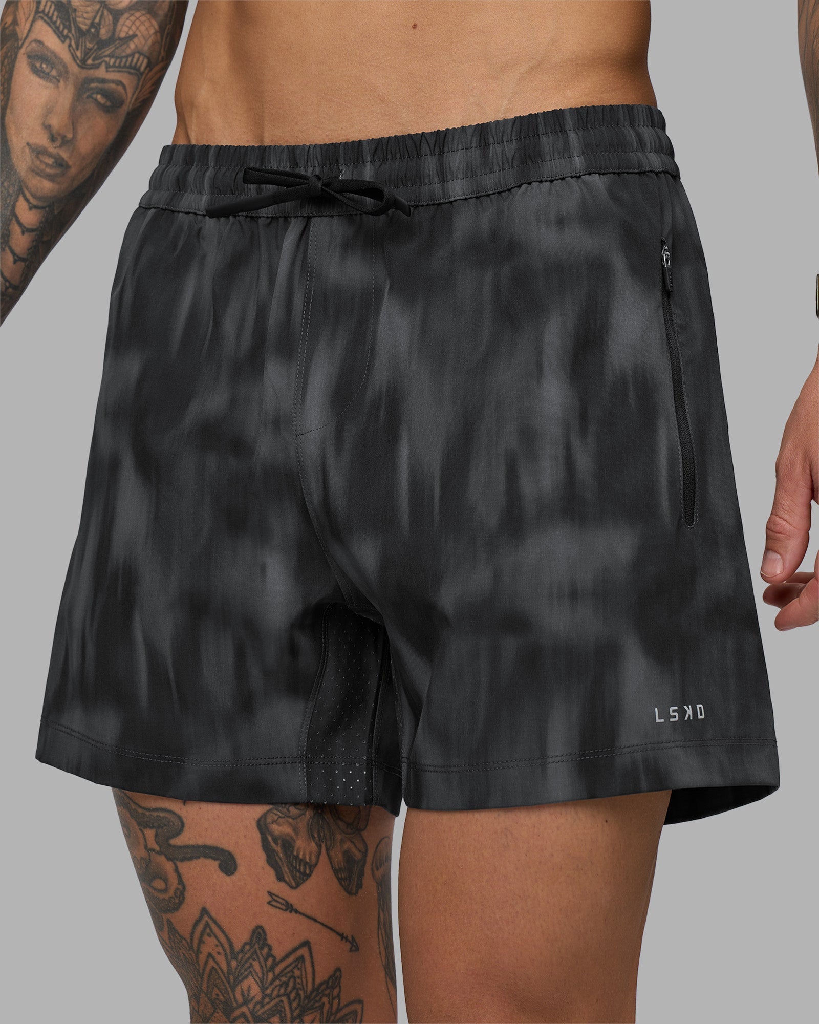 Man wearing Rep 5" Performance Short - Lunar Glow Print | Model:Tommy | Size:S