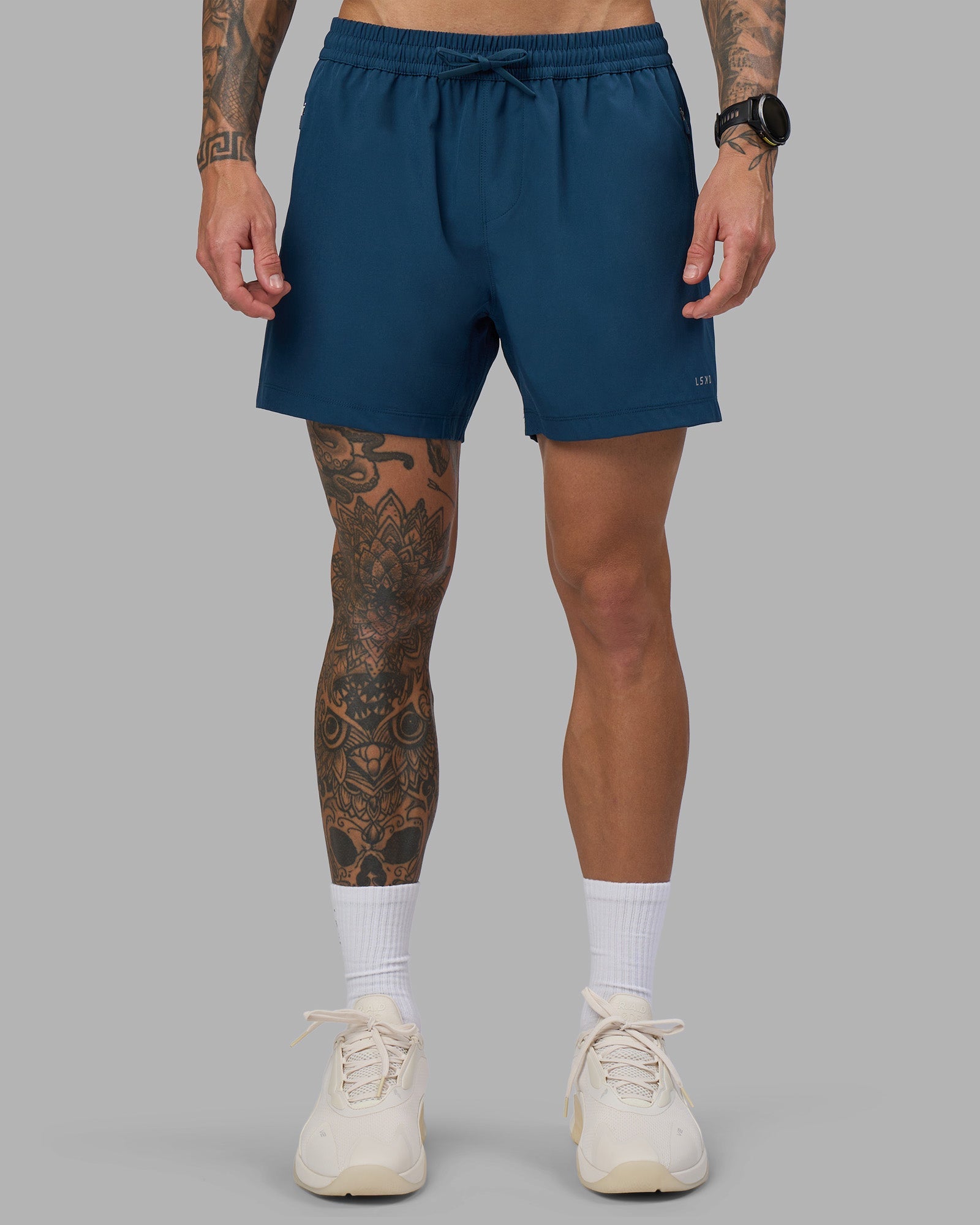 Man wearing Rep 5" Performance Short - Night Sea | Model:Tommy | Size:S