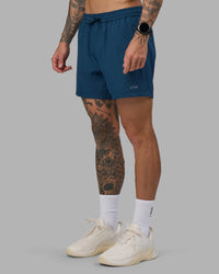 Man wearing Rep 5" Performance Short - Night Sea | Model:Tommy | Size:S