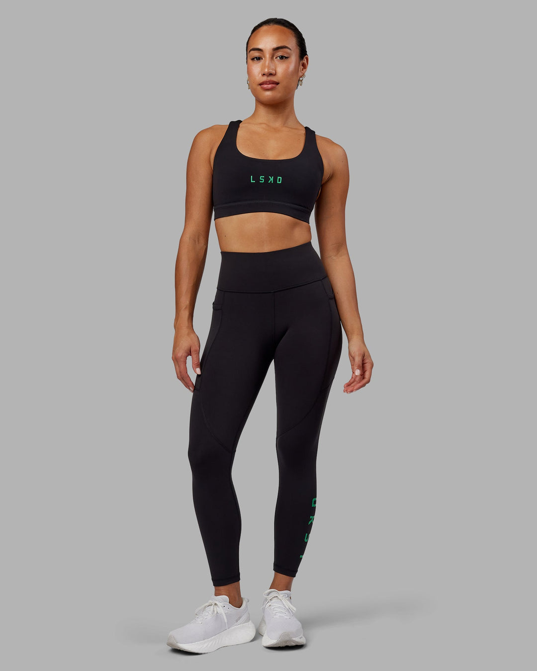 Woman wearing Rep 7/8 Length Leggings - Black-Impact Green