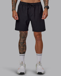 Man wearing Rep 7'' Performance Short in Black-White | Size:S