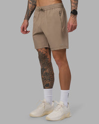 Man wearing Rep 7'' Performance Short - Greige | Model:Tommy | Size:S