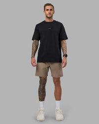 Man wearing Rep 7'' Performance Short - Greige | Model:Tommy | Size:S