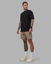 Man wearing Rep 7'' Performance Short - Greige | Model:Tommy | Size:S