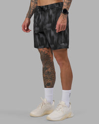 Man wearing Rep 7'' Performance Short - Lunar Glow Print | Model:Tommy | Size:S