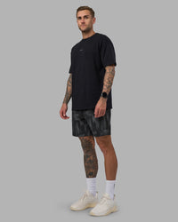 Man wearing Rep 7'' Performance Short - Lunar Glow Print | Model:Tommy | Size:S