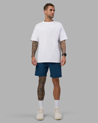 Man wearing Rep 7'' Performance Short - Night Sea | Model:Tommy | Size:S