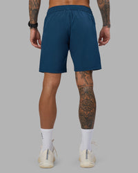 Man wearing Rep 7'' Performance Short - Night Sea | Model:Tommy | Size:S