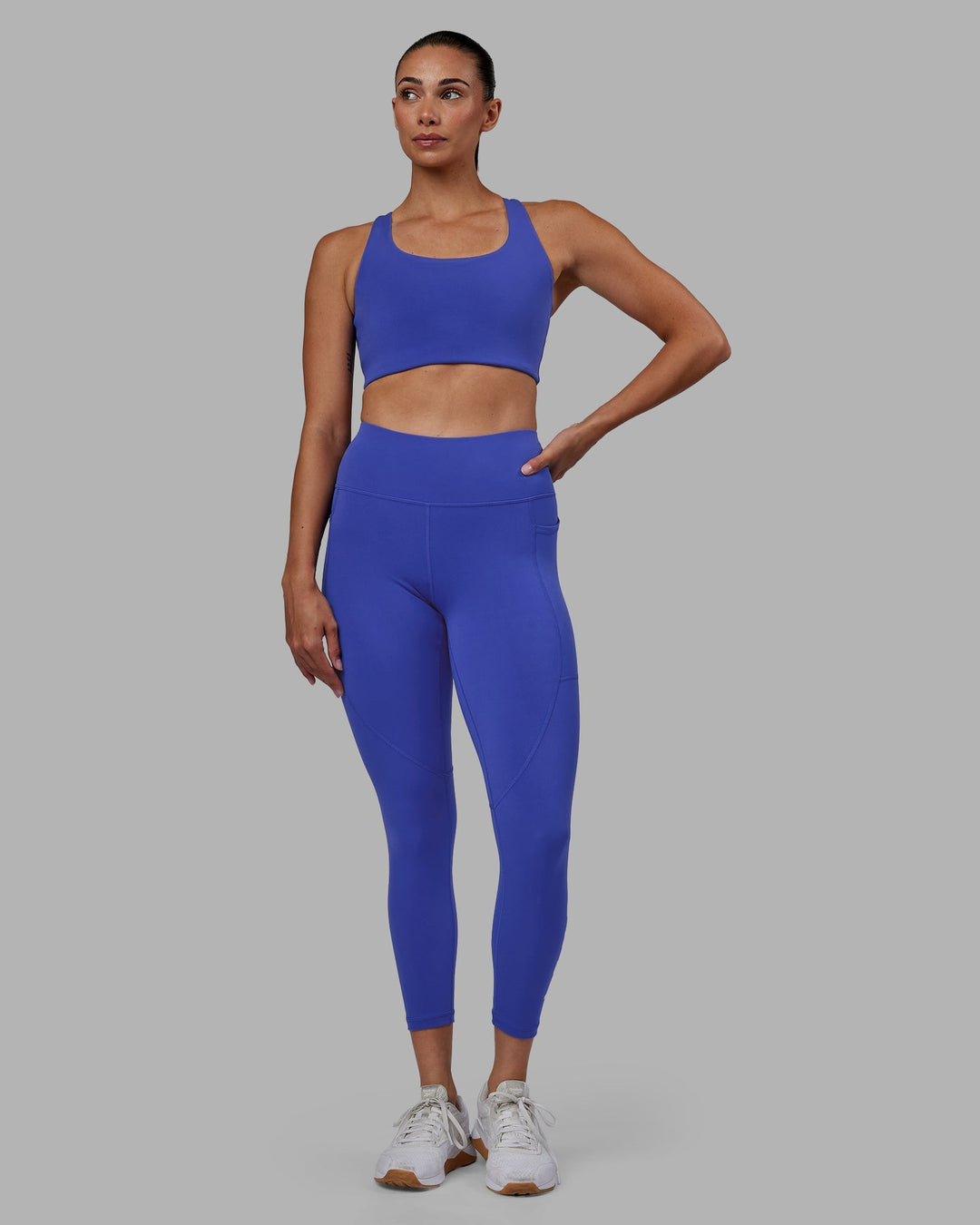 Woman wearing Rep 7/8 Length Leggings - Power Cobalt-White