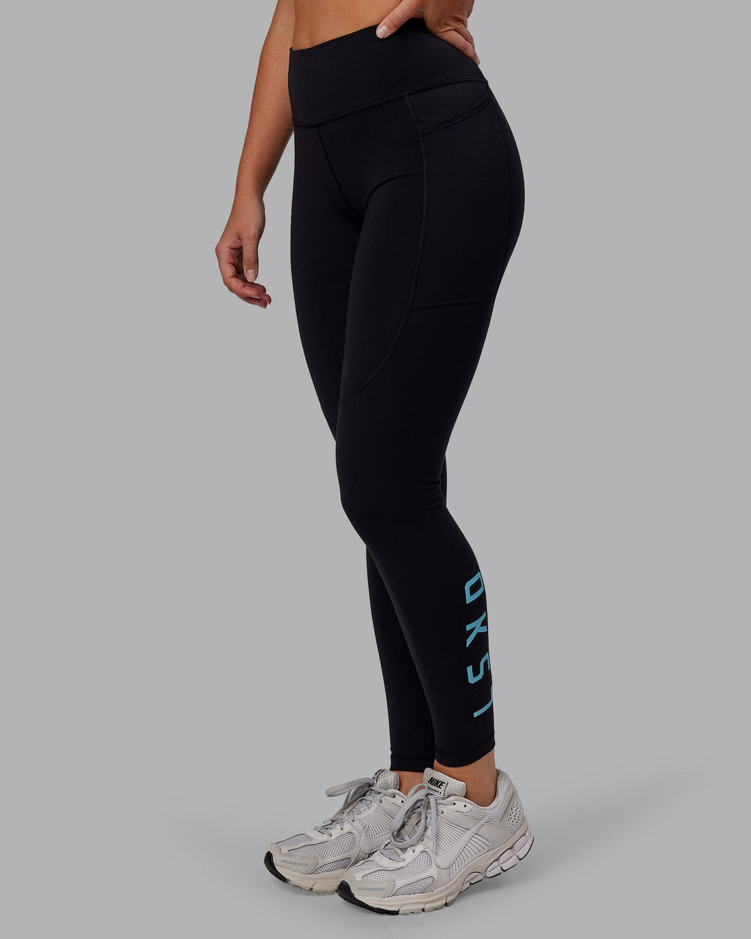 Woman wearing Rep Full Length Tight - Black-Retro Blue | Model:Hannah | Size:S